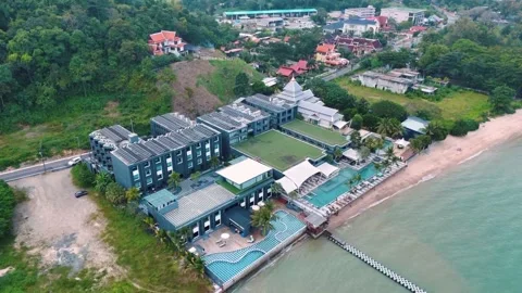 Overhead drone view tropical hotel and pool in Phuket southern Thailand 動画素材 331478756