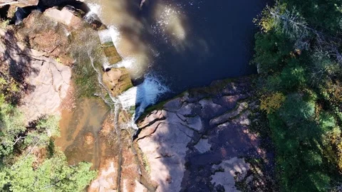 Overhead Drone View of Waterfall Running Through Red Rocks in Autumn Stock Footage 315265384
