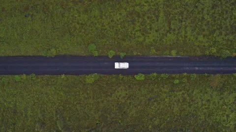 Overhead Drone View White Road Drives Through Middle Grass Iceland Stock Footage 256717198
