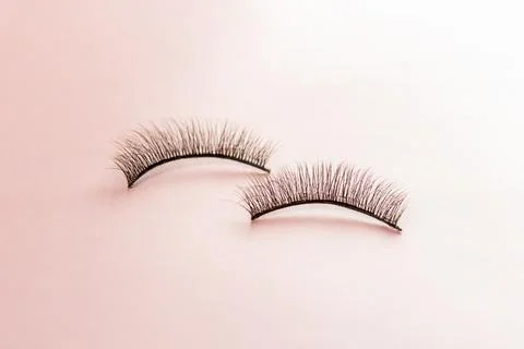 Overhead eyelashes on orange background. Stock Photos