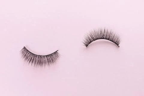 Overhead eyelashes on pink background. Stock Photos