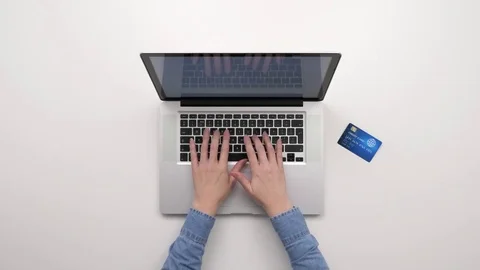 Overhead Of Female Using Laptop And Credit Card Stock Footage 79647516