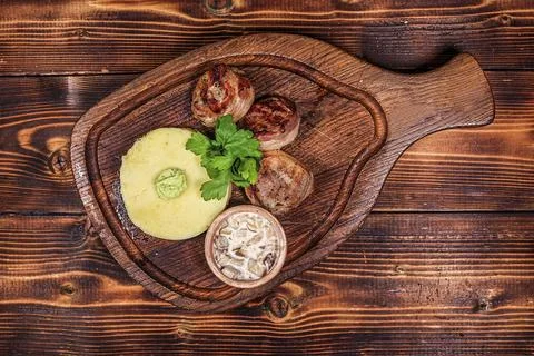 Overhead Flat Lay: Bacon Wrapped Medallions with Puree and Mushroom Sauce o.. Stock Photos