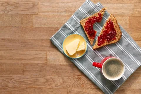 Overhead Flat Lay Shot Of Table Laid For Breakfast With Toast Jam And Coffee Stock Photos