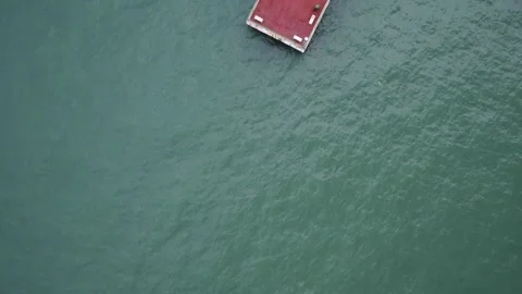 Overhead flyover of empty Bedok Jetty Stock Footage 275893136