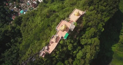 Overhead Flyover Shot Of Buddha Monument And Chedi On Mountain In Krabi, Stock Footage 79065181