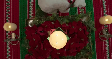 Overhead Focus Pull Pan to Burning Christmas Candle Stock Footage 294862459