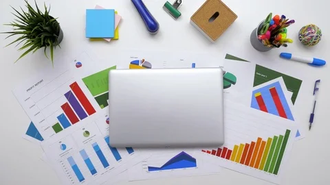 Overhead footage of financial analyst using laptop at table Stock Footage 79648410