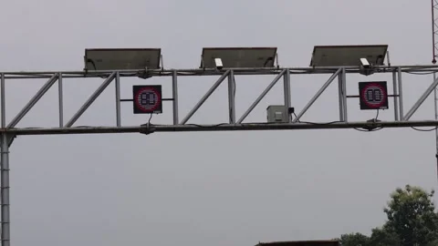 A overhead gantry structure supporting road signs Stock Footage 314522211