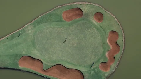 Overhead Golf player sinking a putt on final green at a Nairobi golf course Stock Footage 137285348