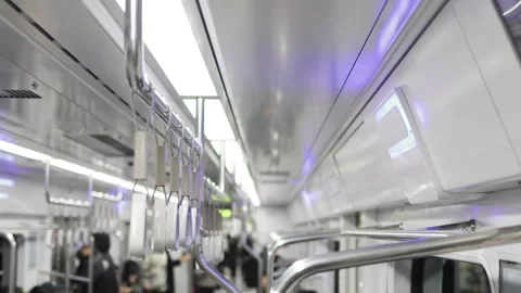 Overhead handles. Simple subway interior emphasizes minimalist aesthetic. Clean Video stock 322089477