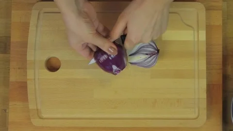 Overhead hands slice red onion on cutting board - Fresh Onion and Knife Cutting Stock Footage 339968260