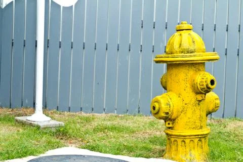 Overhead image of a yellow fire hydrant in dirt. Stock Photos