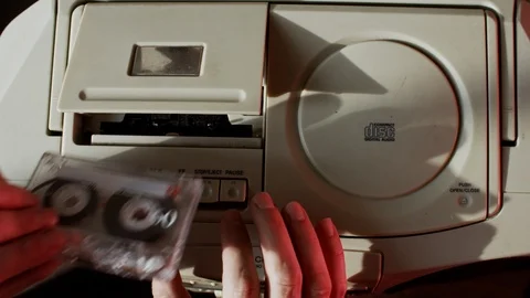Overhead Insert Cassette Tape into Cassete Player Video stock 106396060