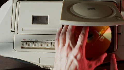 Overhead Insert CD into Old Player Video stock 106395621