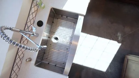 Overhead Kitchen Sink Pan to Granite Counter Stock Footage 76256146