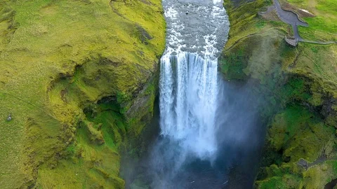 Overhead lockdown shot of water rushing down from the Skogafoss Waterfall Stock Footage 120045934