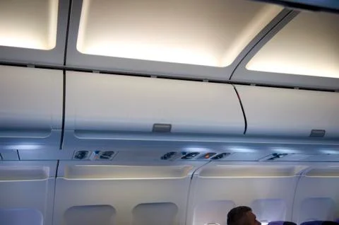 Overhead locker aeroplane Foto stock