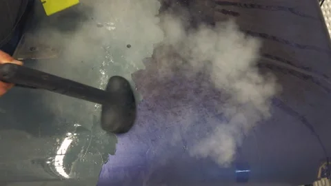 Overhead Look At The Removal of Large Vinyl Piece On A Hood Video stock 132439984