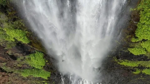 Overhead look at a waterfall crashing into its pool on Kauai 스톡 동영상 96046098