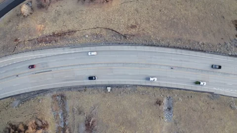 Overhead looking down on traffic on curved Provo Canyon highway at sunset Stock Footage 242825219