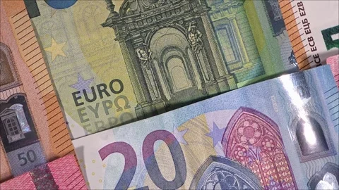 Overhead macro view of rotating euro banknotes texture, financial background Stock Footage 336985051