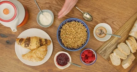 Overhead Of Man Adding Healthy Ingredient Over Granola 4K Stock Footage 92100174
