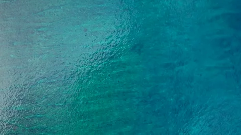 Overhead ocean waves breaking over shallow coral reef. dLovely aerial view rone Stock Footage 344605301