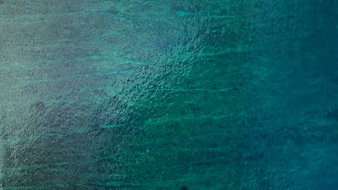 Overhead ocean waves breaking over shallow coral reef. dMagic aerial view rone Stock Footage 344605981