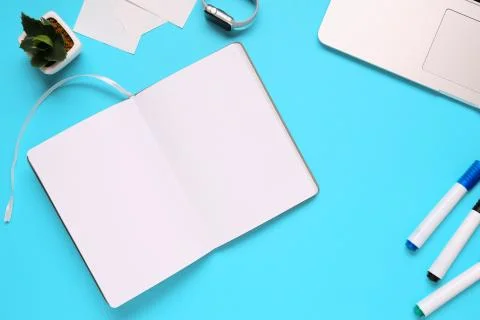 Overhead of office table with notepad, notebook and clock and felt pen. Copy  Stock Photos