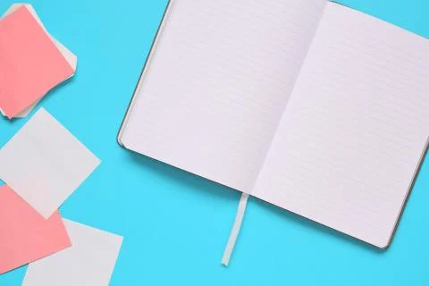 Overhead of office table with notepad, notebook and clock and felt pen. Copy  Stock Photos
