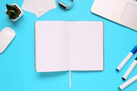 Overhead of office table with notepad, notebook and clock and felt pen. Copy  Stock Photos