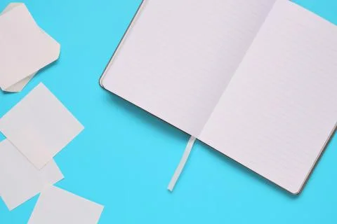 Overhead of office table with notepad, notebook and clock and felt pen. Copy  Stock Photos