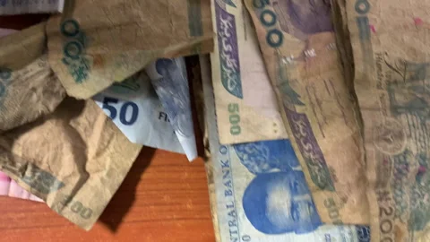 Overhead pan of Naira notes on the table Stock Footage 261116646