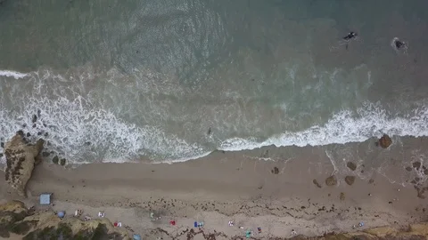 Overhead Panning Left of Waves Crashing on Coastline 4k Stock Footage 92928924