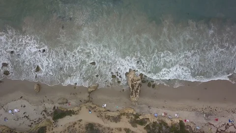 Overhead Panning Right of Waves Crashing on Coastline 4k Stock Footage 92929013