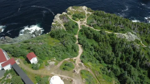 An overhead pass of the Long Point Lighthouse and cliffs at Crow Head Stock Footage 228682513