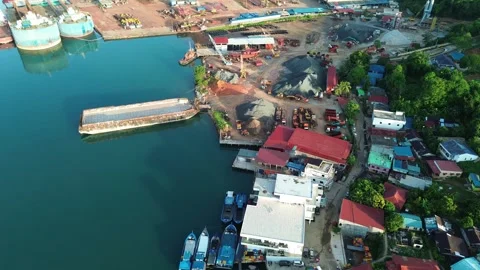 Overhead Perspective of a Coastal Industrial Complex with Maritime Vessels .. Stock Footage 337283063