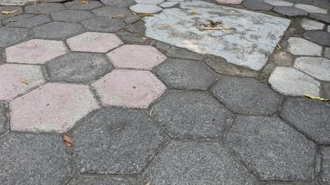 An overhead perspective displays interlocking hexagonal concrete paving sto.. Stock Photos