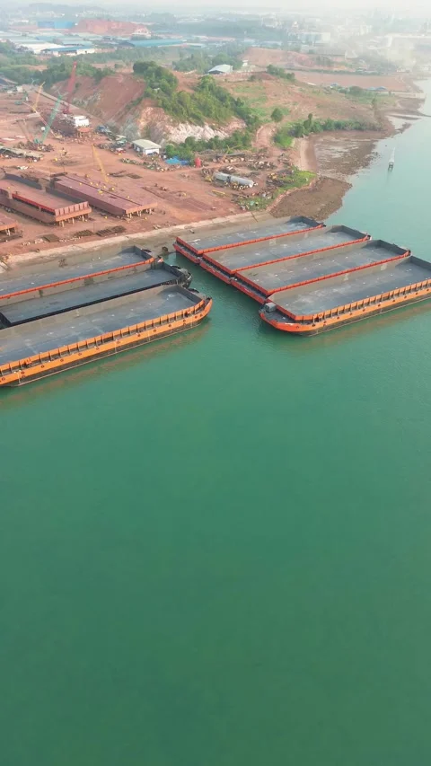 Overhead Perspective of a Dynamic Inland Waterway Port Facility with Laden .. Stock Footage 337281607
