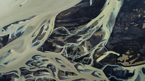 Overhead perspective of glacial braided river system with pale gray silty mel Stock Photos