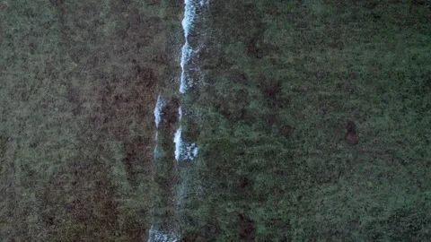 Overhead perspective ocean waves breaking over shallow coral reef. Dramatic Stock Footage 340795016