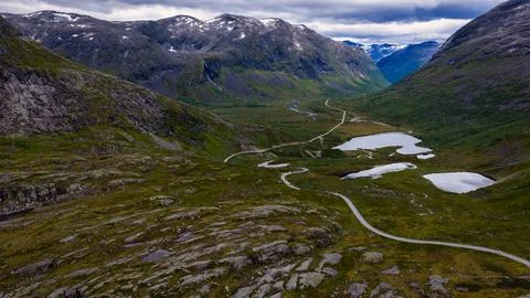 Overhead perspective of Rauma mountain valley in Norway showing serpentine ro Stock-Fotos