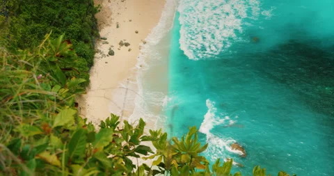 Overhead perspective of secluded beach cove at Nusa Penida Bali Indonesia Stock Footage 345687813