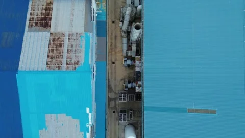 Overhead Perspective: Surveying the Vibrant Blue Rooftops and Complex Syste.. Stock Footage 339036076