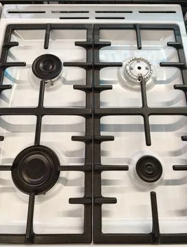 Overhead perspective of white gas range with four burners Stock Photos