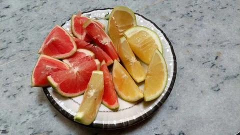 Overhead Photograph of Ruby Red and Golden Yellow Grapefruit Slices Stock Photos