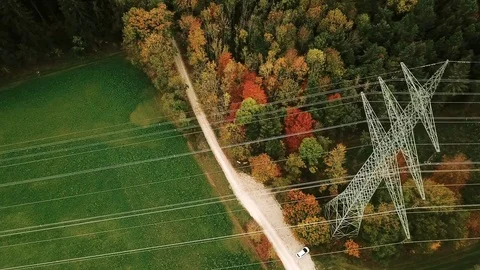 Overhead power line running through countryside Stock Footage 100058449