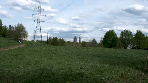 Overhead power line support (transmission line support) in the park among trees 库存影片 240433835