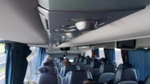 Overhead reading light and vents inside passenger coach with shallow depth of Vidéo 344587401